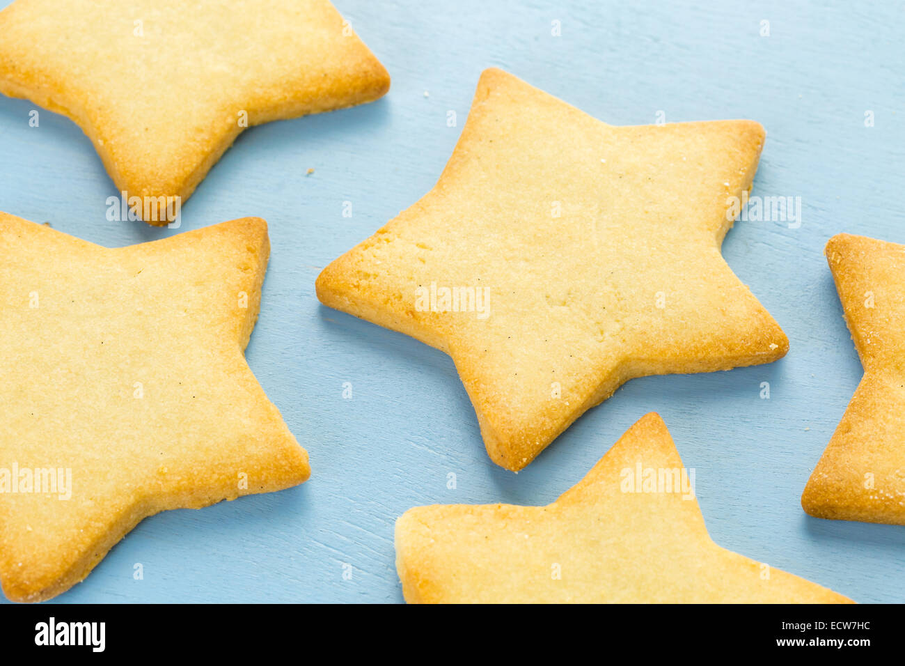 Sugar cookies in shape eof stars on blue background. Stock Photo