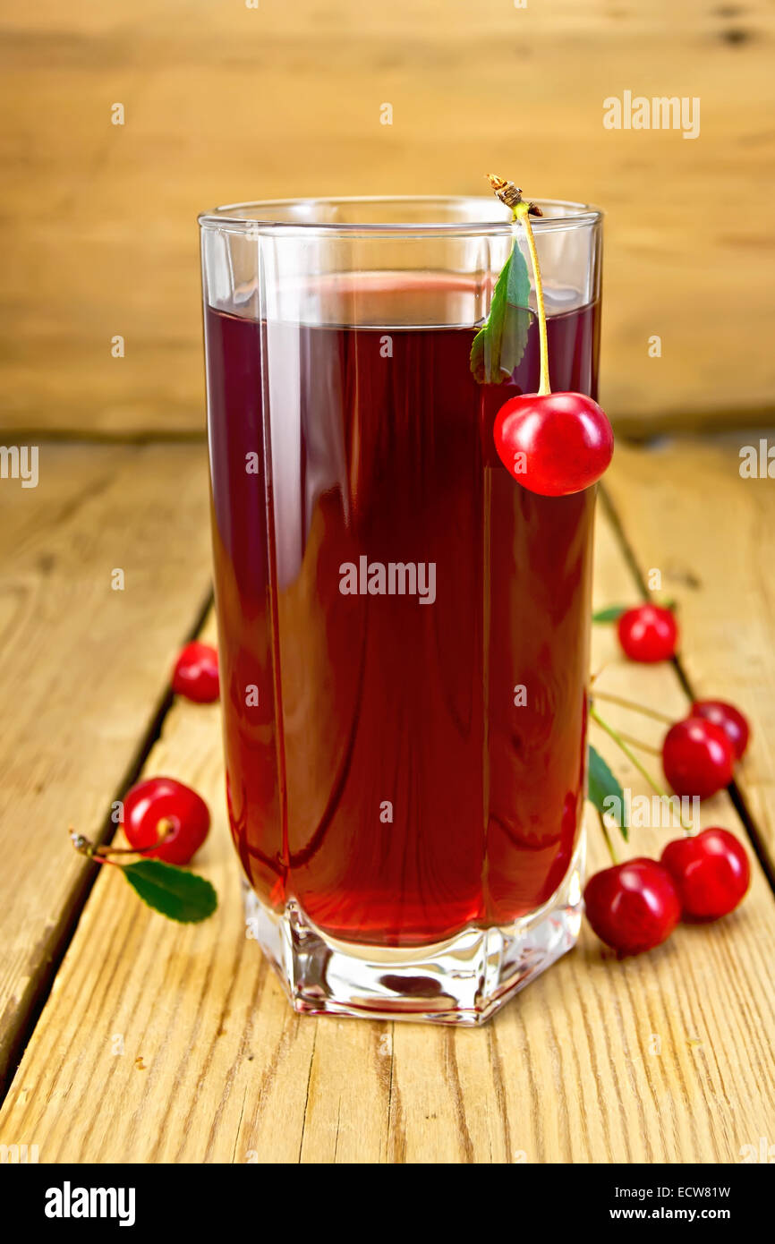 Compote cherry in tall glass on board Stock Photo Alamy