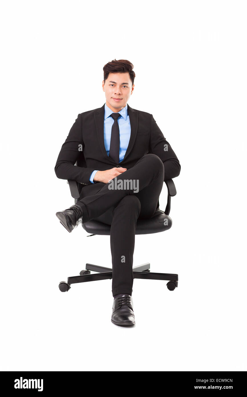 Young businessman sitting in a chair Stock Photo