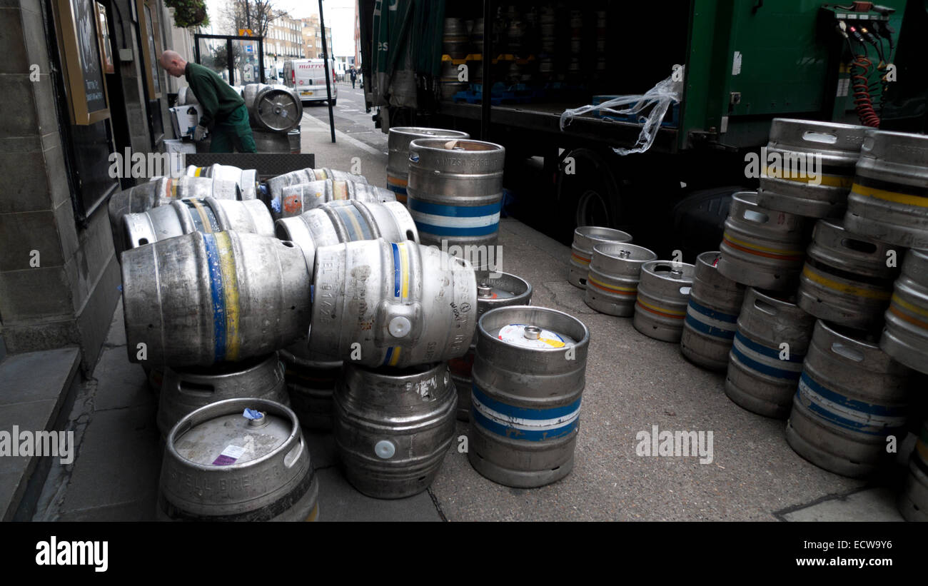 Beer kegs on pavement outside pub and delivery lorry in Victoria street London, UK  KATHY DEWITT Stock Photo