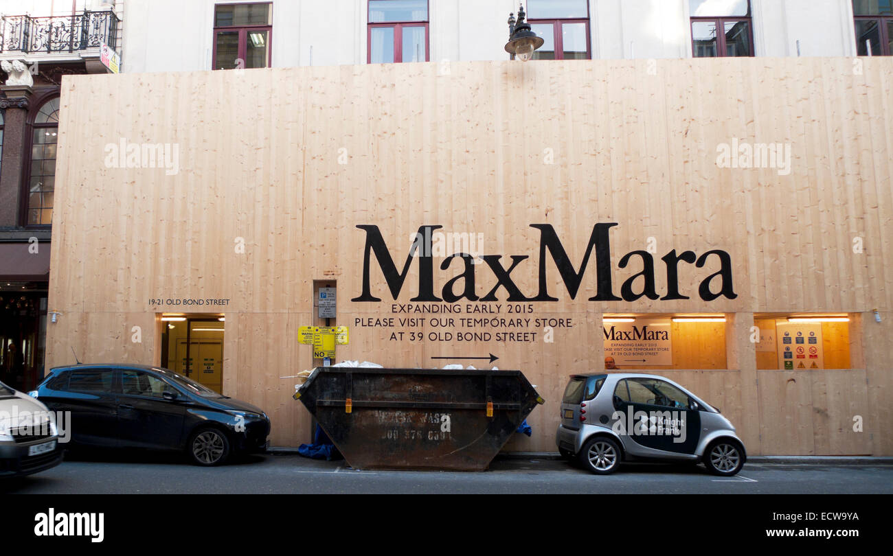 Expanding MaxMara store refurbishment sign and hoarding on Old Bond Street London, UK  2014    KATHY DEWITT Stock Photo