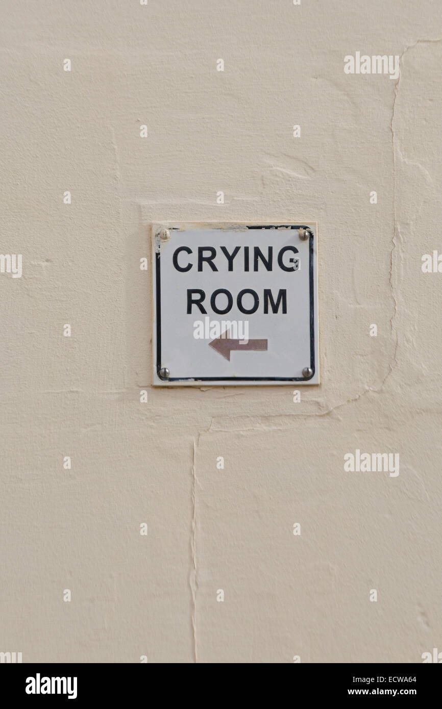 Sign for the Crying room on the wall of a church in Malta Stock Photo