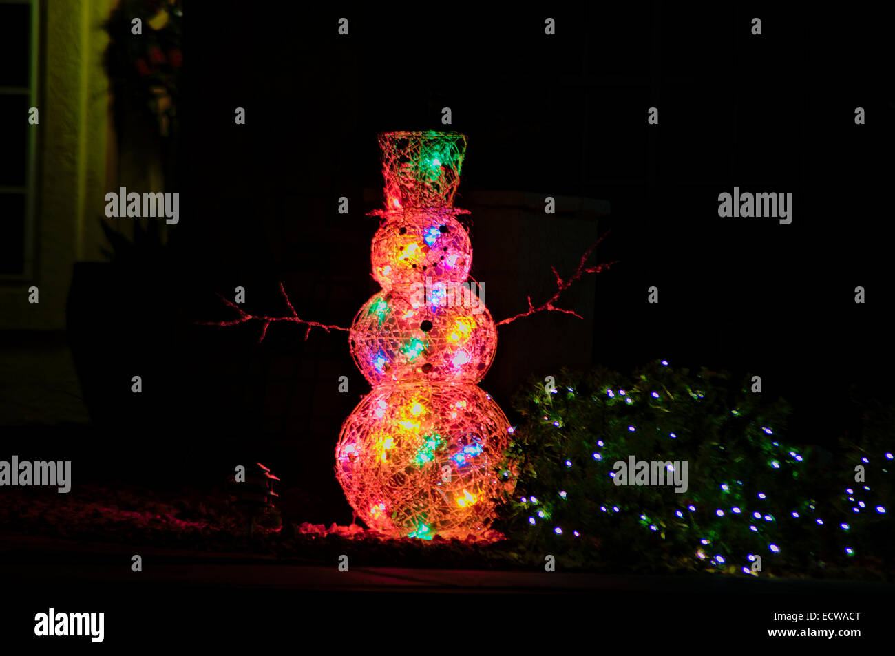 Frosty the Snowman made of various colored lights on display for Christmas. Stock Photo