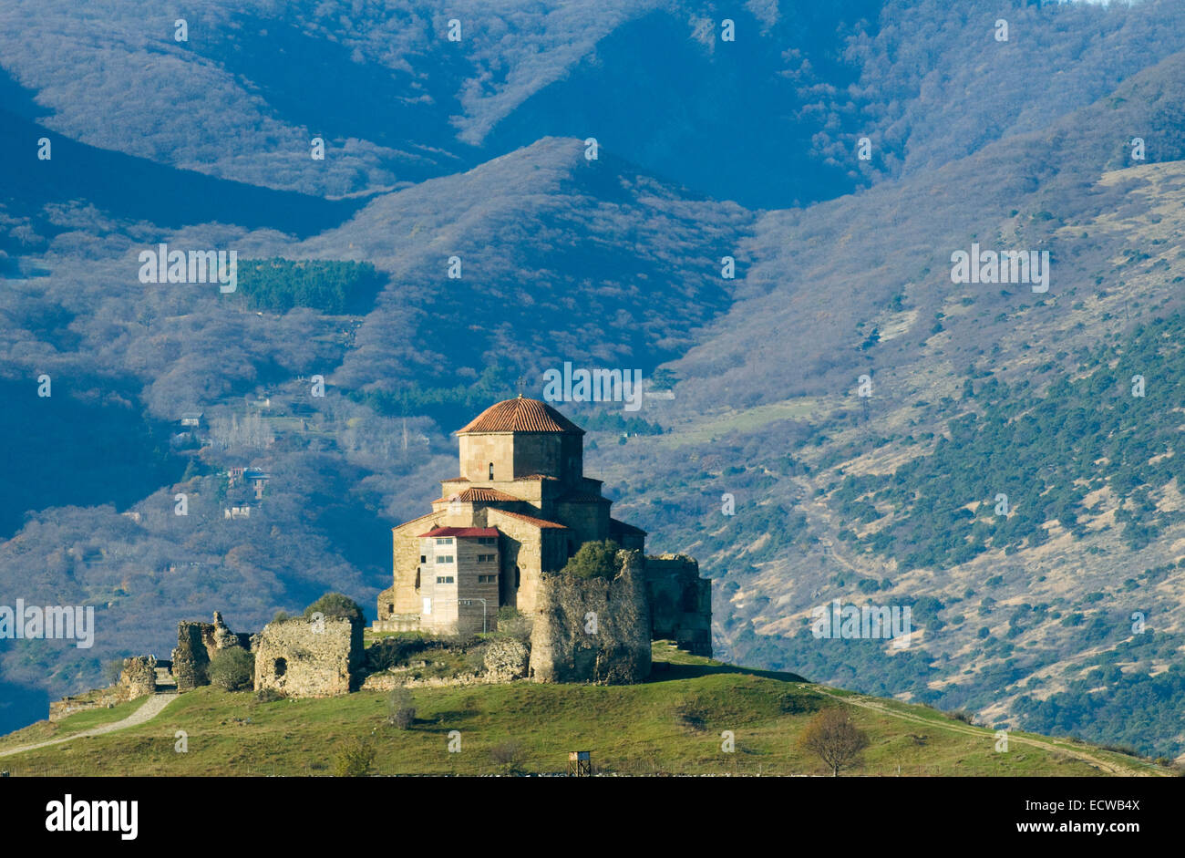 Famous Jvari church is situated on the mountain top and surrounded with mountains. Stock Photo