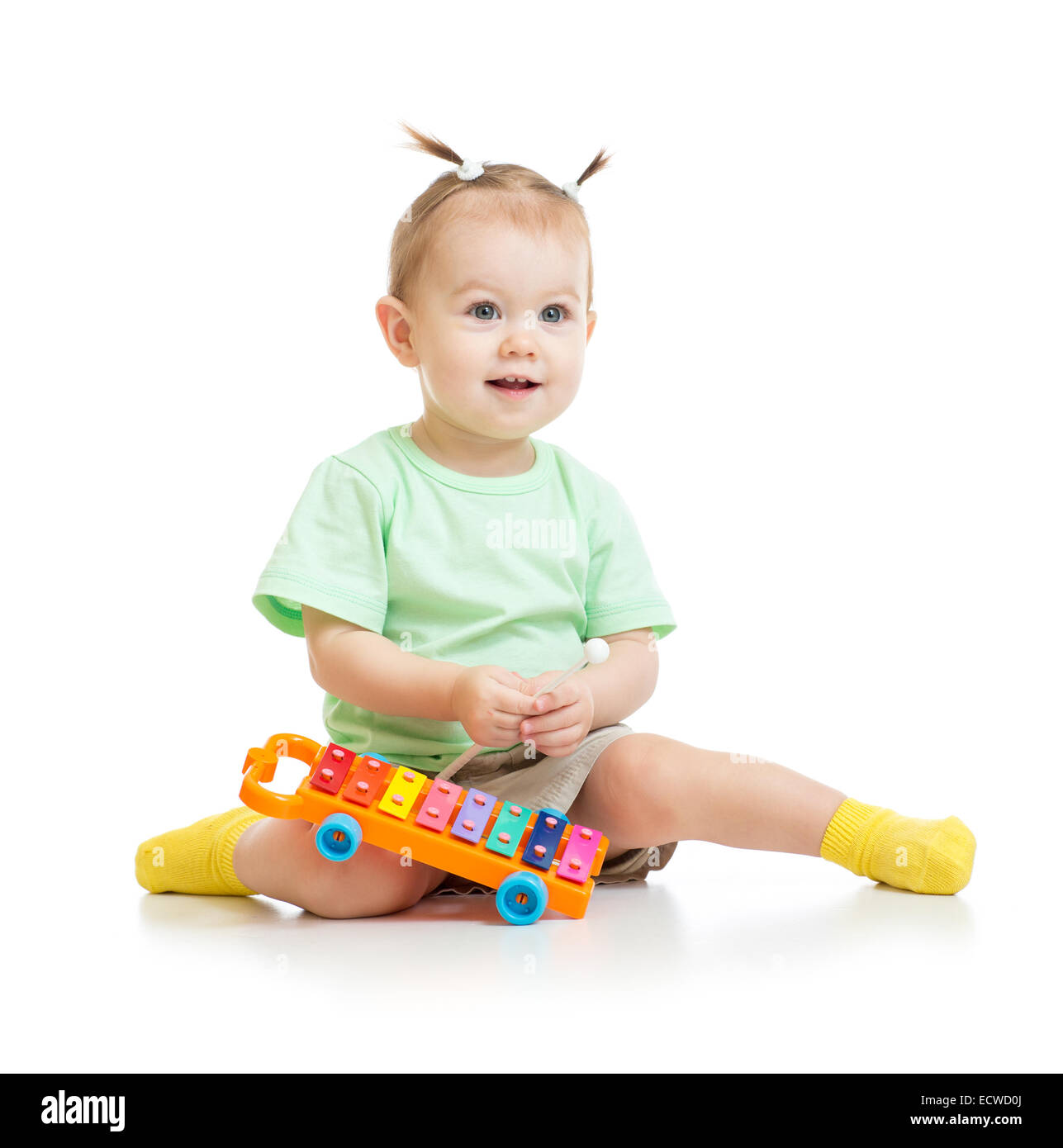 funny baby playing with xylophone isolated Stock Photo