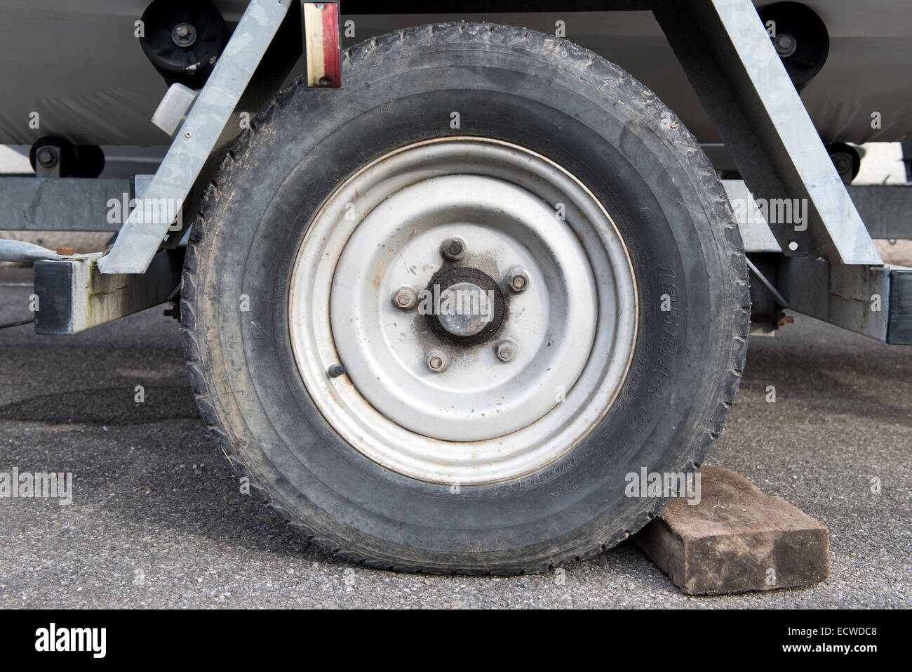 a used boat trailer wheel Stock Photo Alamy