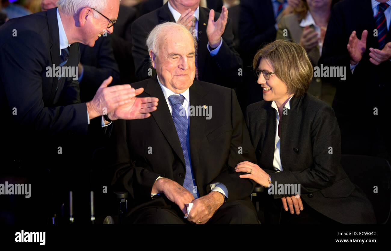 German Chancellor a.D. Helmut Kohl (C) next to his wife Maike Kohl-Richter during the ceremony 'Gluecklich vereint. Von der Deutschen Einheit zur Europaeischen Einigung' (lit. 'Happily united. From the German Unity until the European Union') in Dresden, Germany, 19 December 2014. 25 years ago, on 19 December 1989, the German Chancellor Dr. Hemlut Kohl (CDU) visited Dresden and delivered a speech in front of the ruins of the Frauenkirche. With the ceremony the Konrad-Adenauer foundation remembers the events of December 1989 in Dresden. Photo: Arno Burgi/dpa Stock Photo