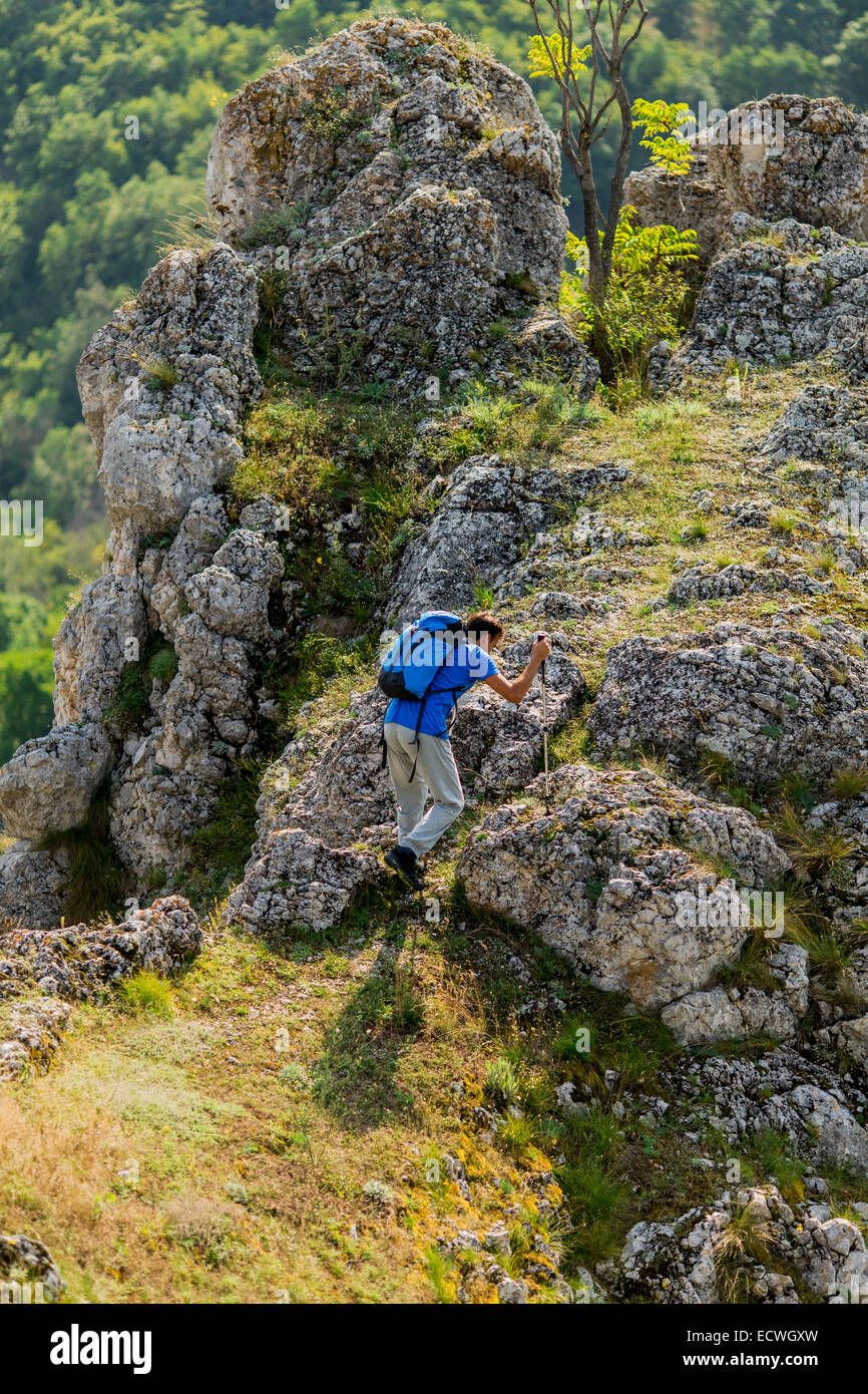 Young man hiking on the mountain Stock Photo - Alamy