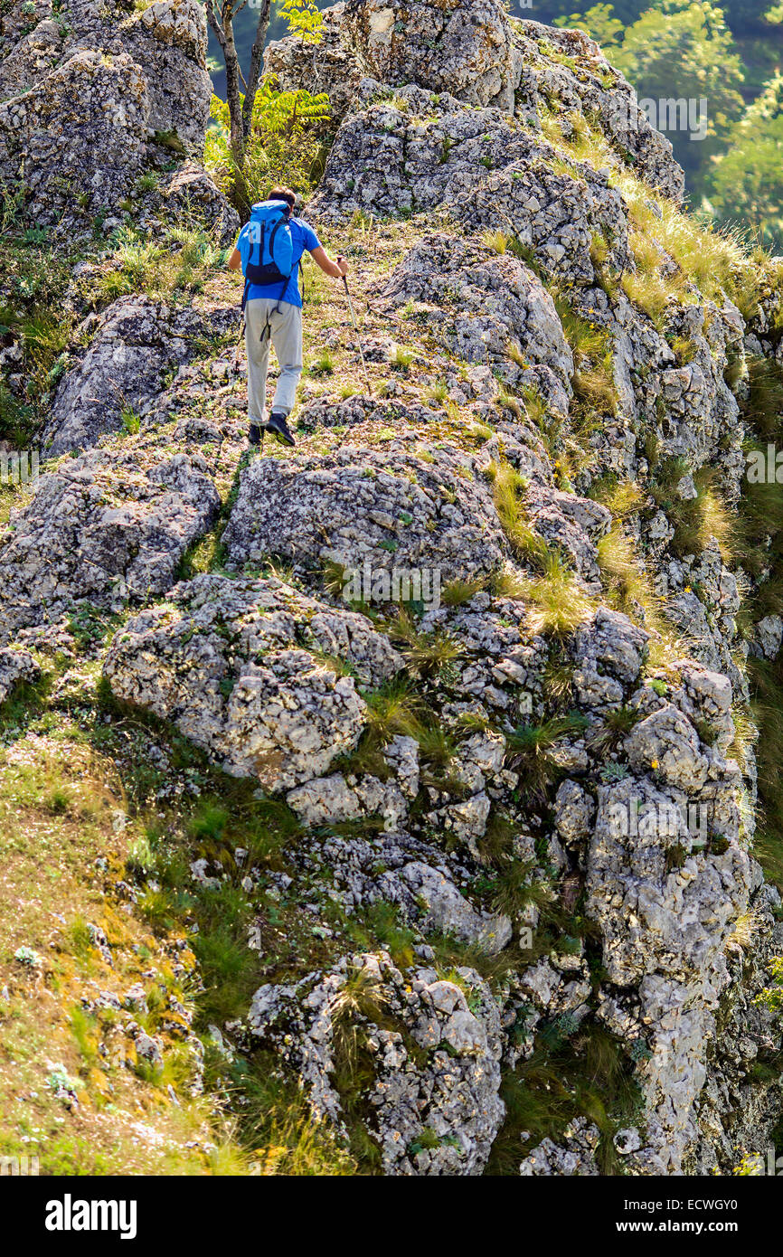 Young man hiking on the mountain Stock Photo - Alamy