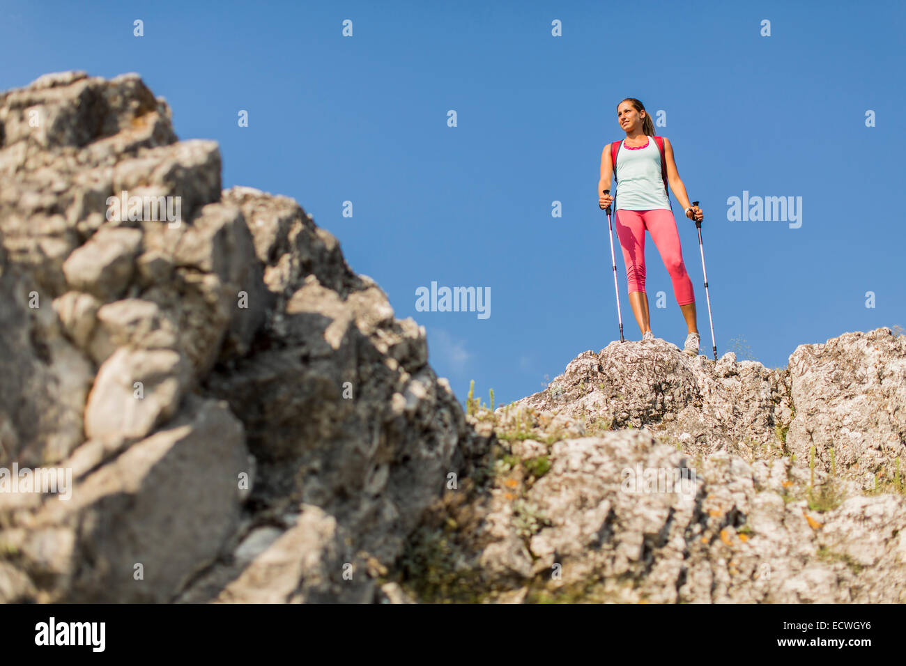 Young woman hiking on the mountain Stock Photo