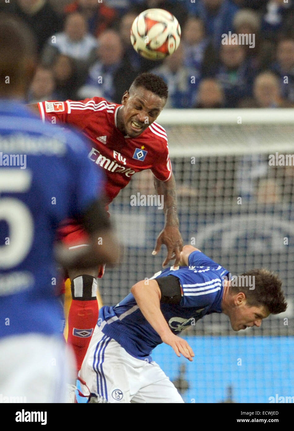 Gelsenkirchen, Germany. 20th Dec, 2014. Schalke's Klaas-Jan Huntelaar (R) and Hamburg's Cleber (TOP) vie for the ball during the Bundesliga soccer match between FC Schalke 04 and Hamburger SV at Veltins arena in Gelsenkirchen, Germany, 20 December 2014. Photo: Caroline Seidel/dpa (ATTENTION: Due to the accreditation guidelines, the DFL only permits the publication and utilisation of up to 15 pictures per match on the internet and in online media during the match.)/dpa/Alamy Live News Stock Photo