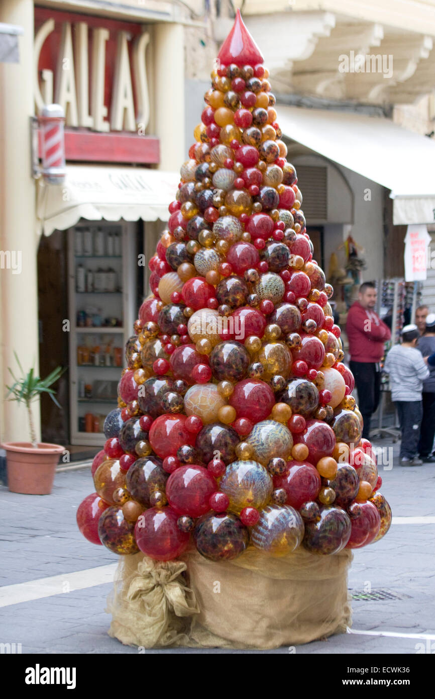 Christmas tree made of Mdina Glass on the streets of Valletta Malta Stock Photo
