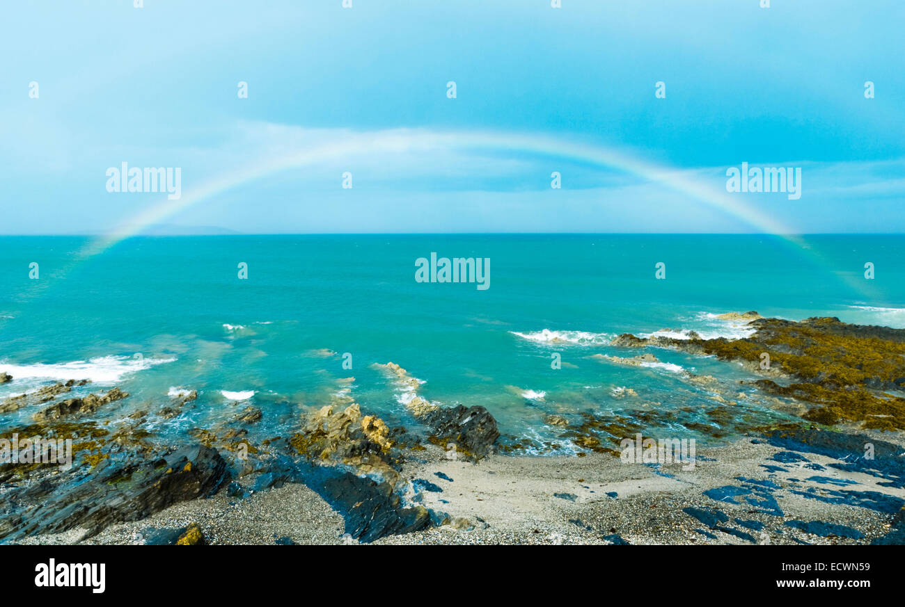 Full rainbow over sea in Malahide, Republic of Ireland, Europe Stock Photo