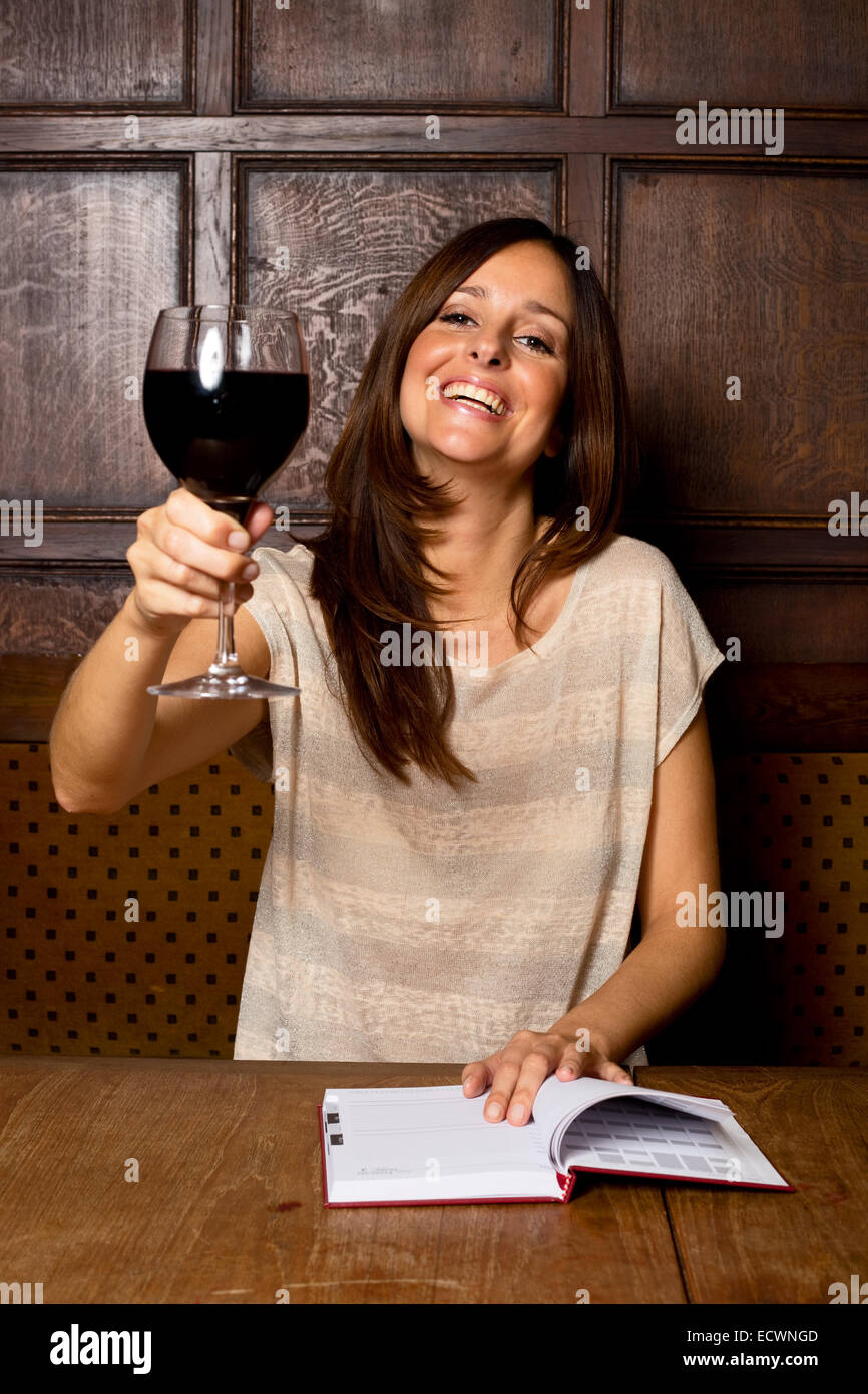 young woman enjoying a glass of wine Stock Photo - Alamy