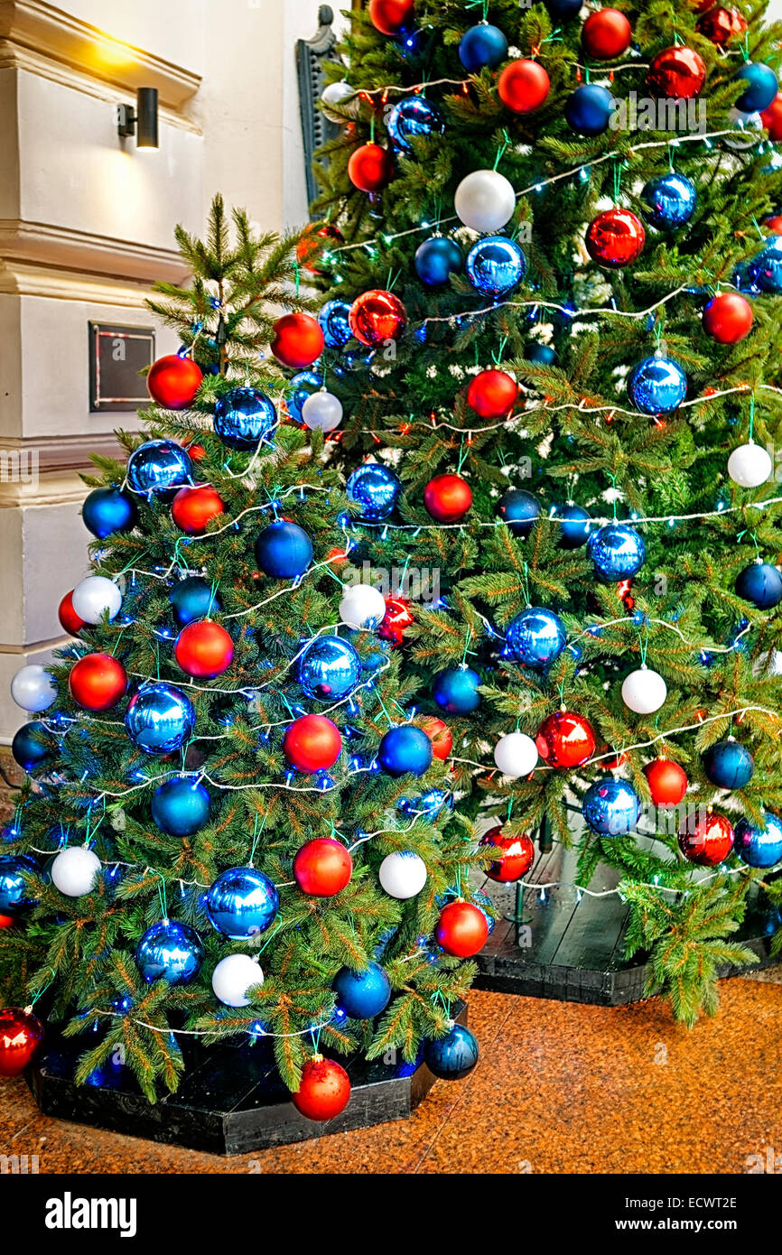 Red, blue and white decorating balls on the christmas tree at the ...