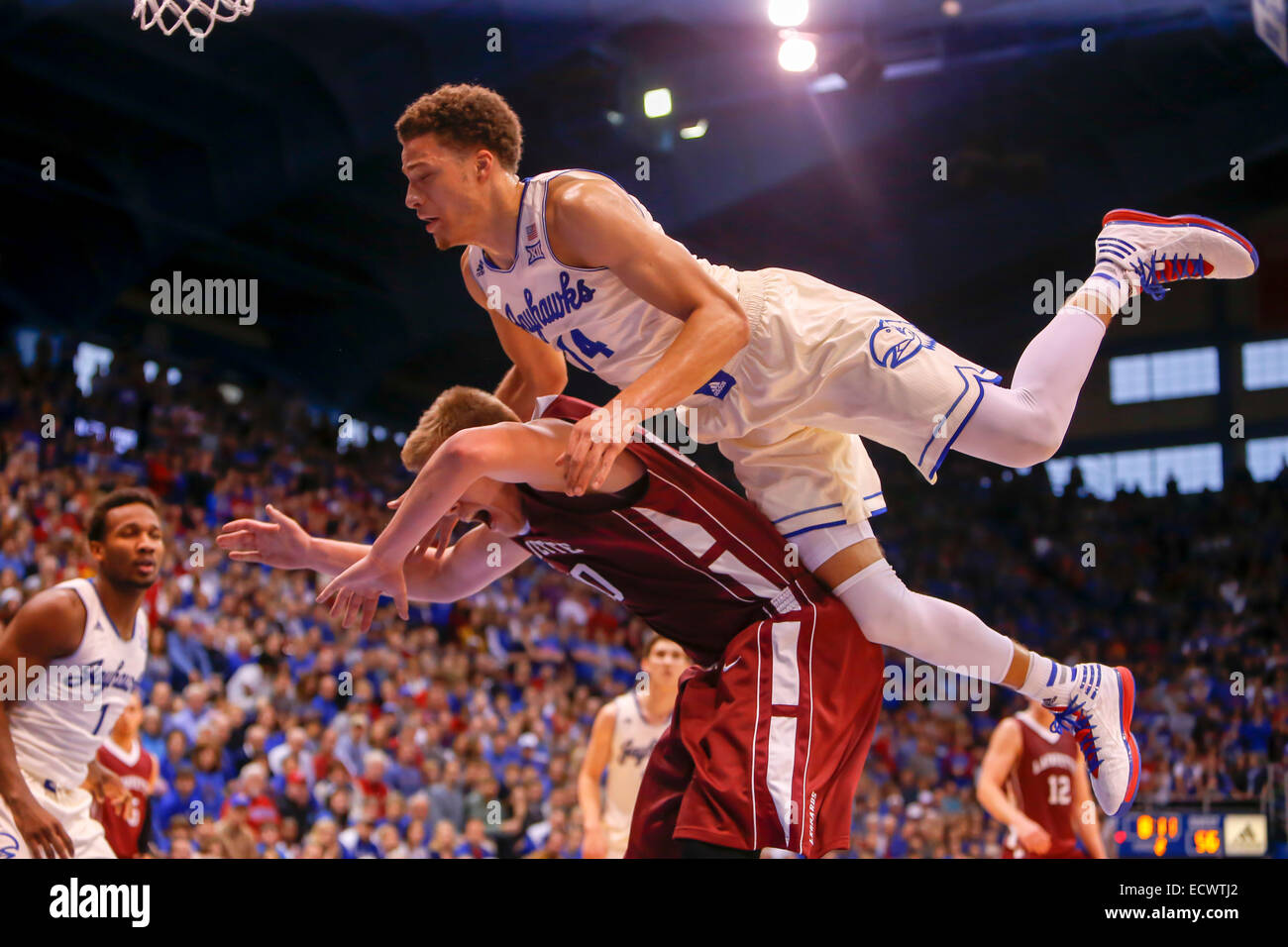 Lawrence, Kansas, USA. 20th Dec, 2014. December 20, 2014: Brannen Greene #14 of the Kansas Jayhawks fouls Dan Trist #20 of the Lafayette Leopards late in the second half during the NCAA basketball game between the Lafayette Leopards and the Kansas Jayhawks at Allen Fieldhouse in Lawrence, KS Credit:  Cal Sport Media/Alamy Live News Stock Photo