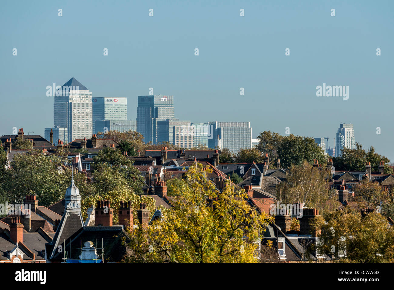 Views of Canary Wharf, the second financial district of London viewed across the rooftops of Herne Hill in South London Stock Photo