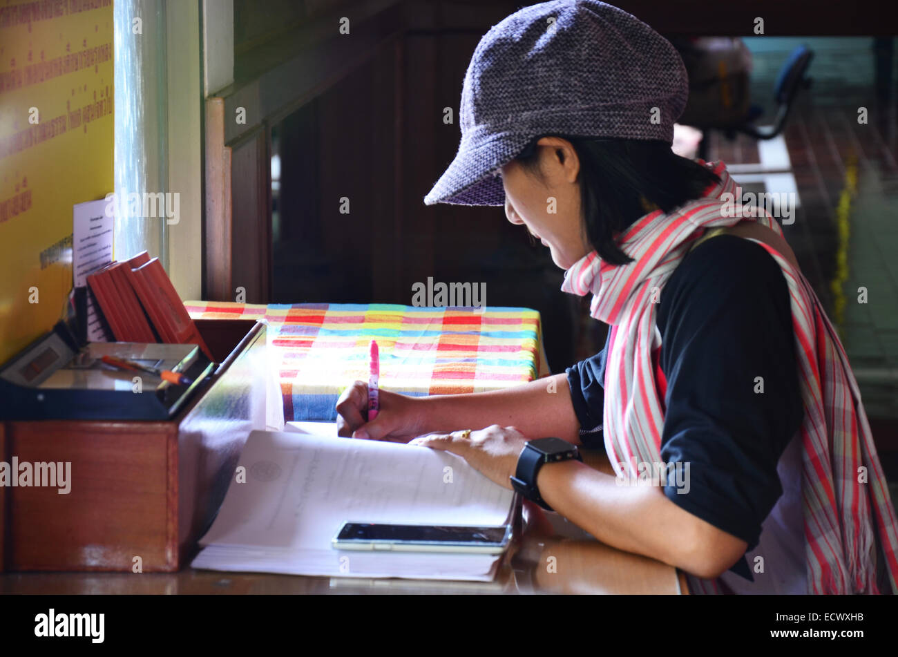 Thai women write memory on book Stock Photo - Alamy
