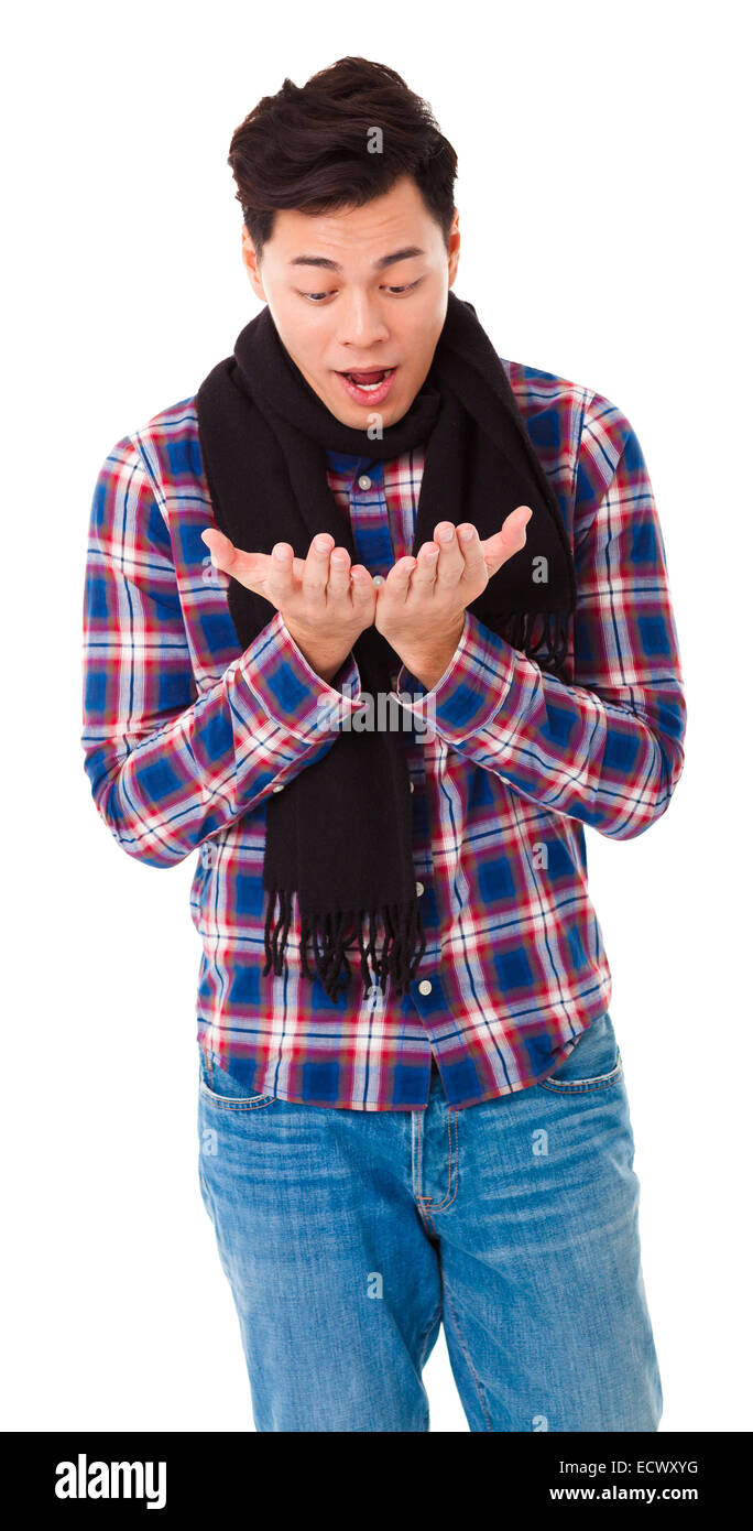 surprised  young man looking his hands Stock Photo