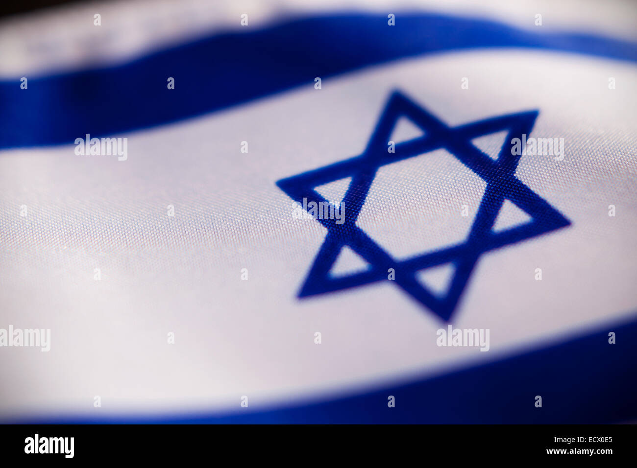 Abstract macro view of Israeli flag with shallow depth of field. Stock Photo