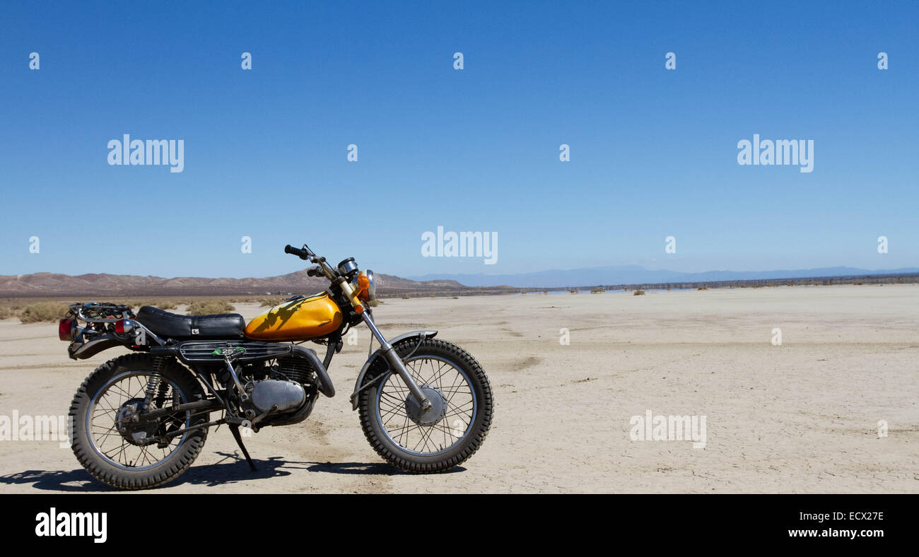 A 70's motorcycle in the desert. Stock Photo