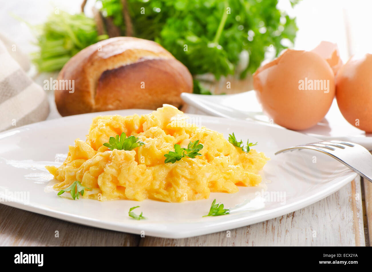 Scrambled eggs with fresh herbs. Selective focus Stock Photo - Alamy