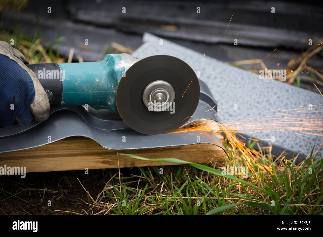 sharpening and cutting of iron by abrasive disk machine Stock Photo - Alamy