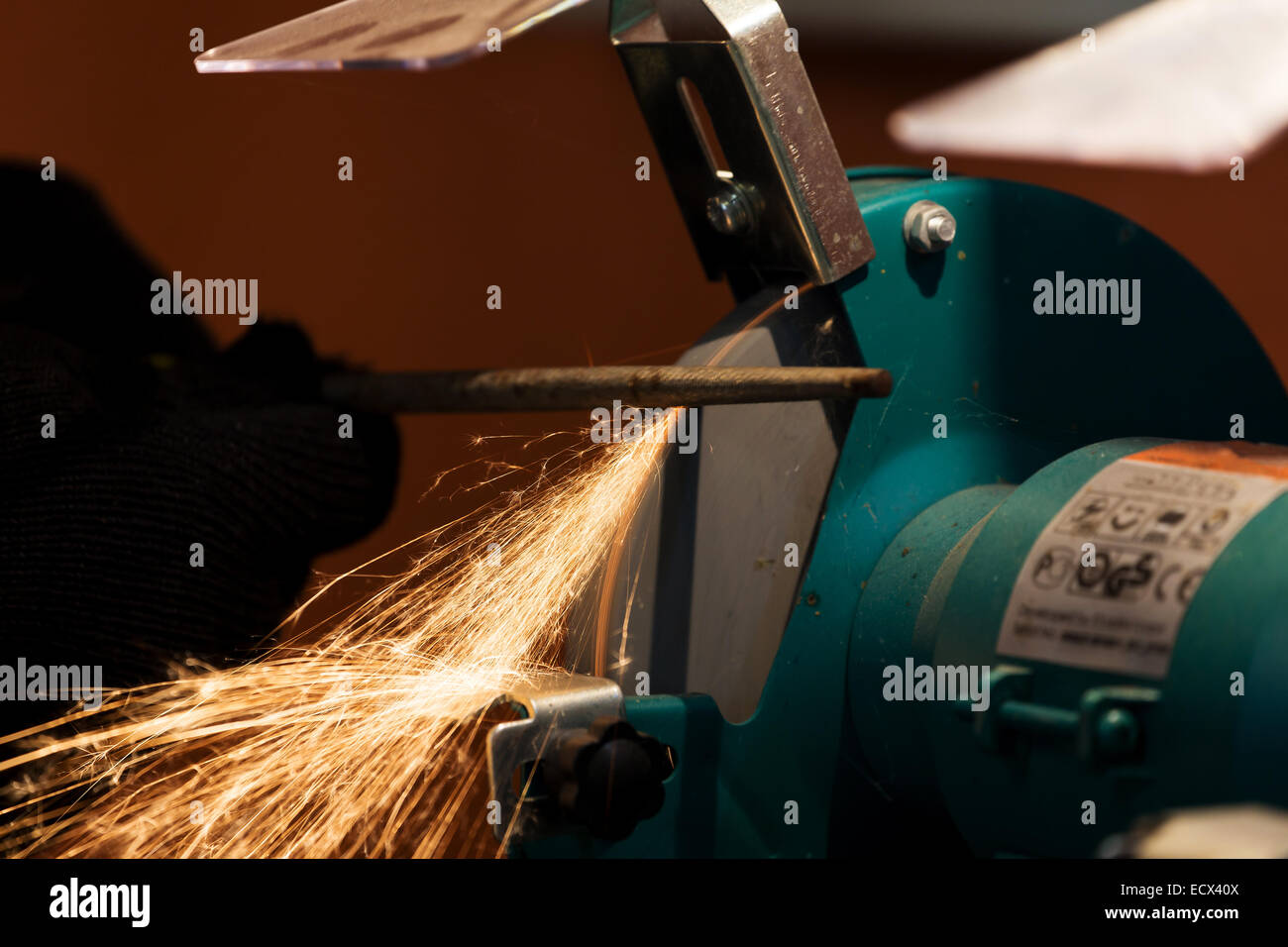 sharpening and cutting of iron by abrasive disk machine Stock Photo - Alamy