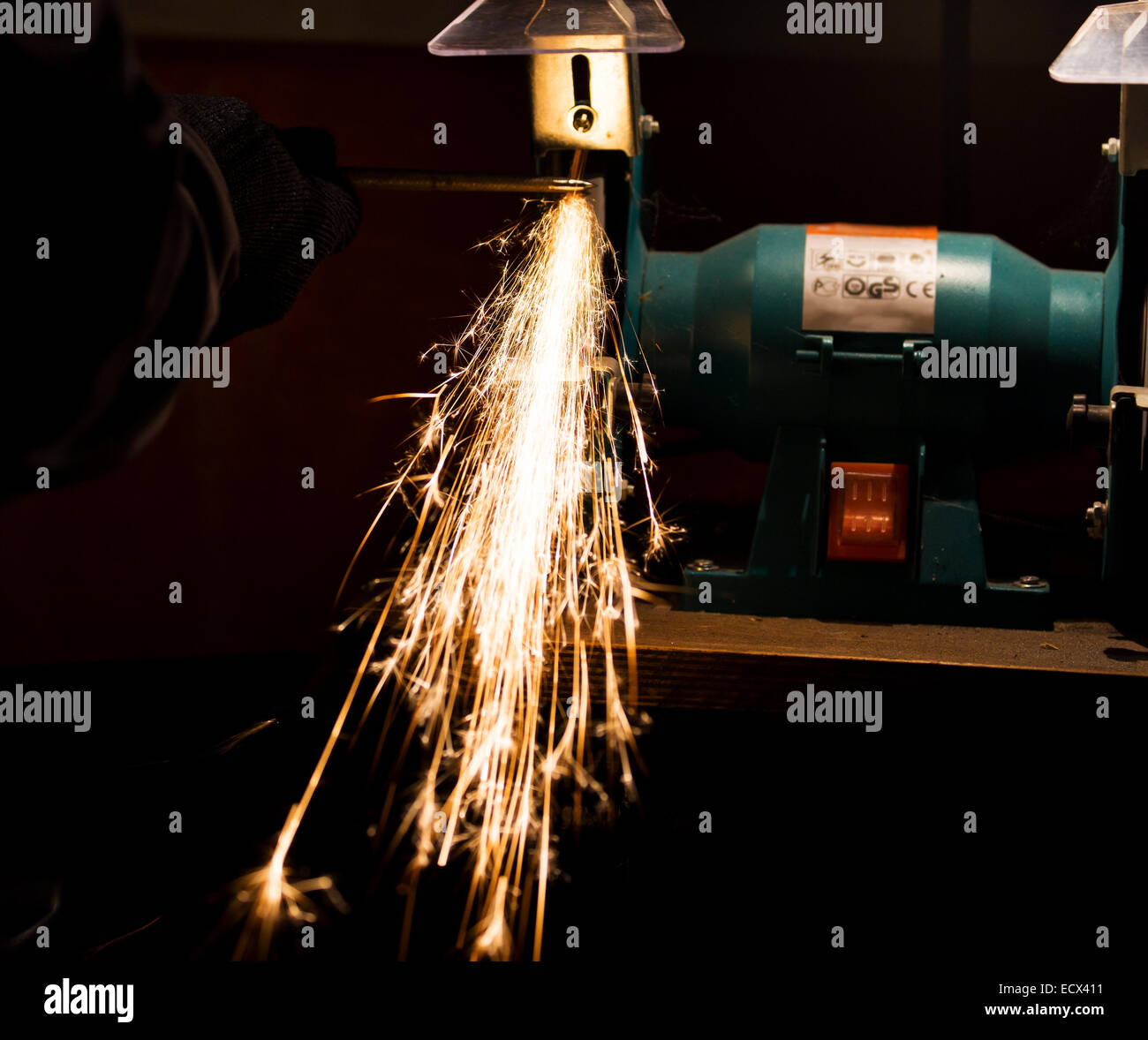 sharpening and cutting of iron by abrasive disk machine Stock Photo - Alamy