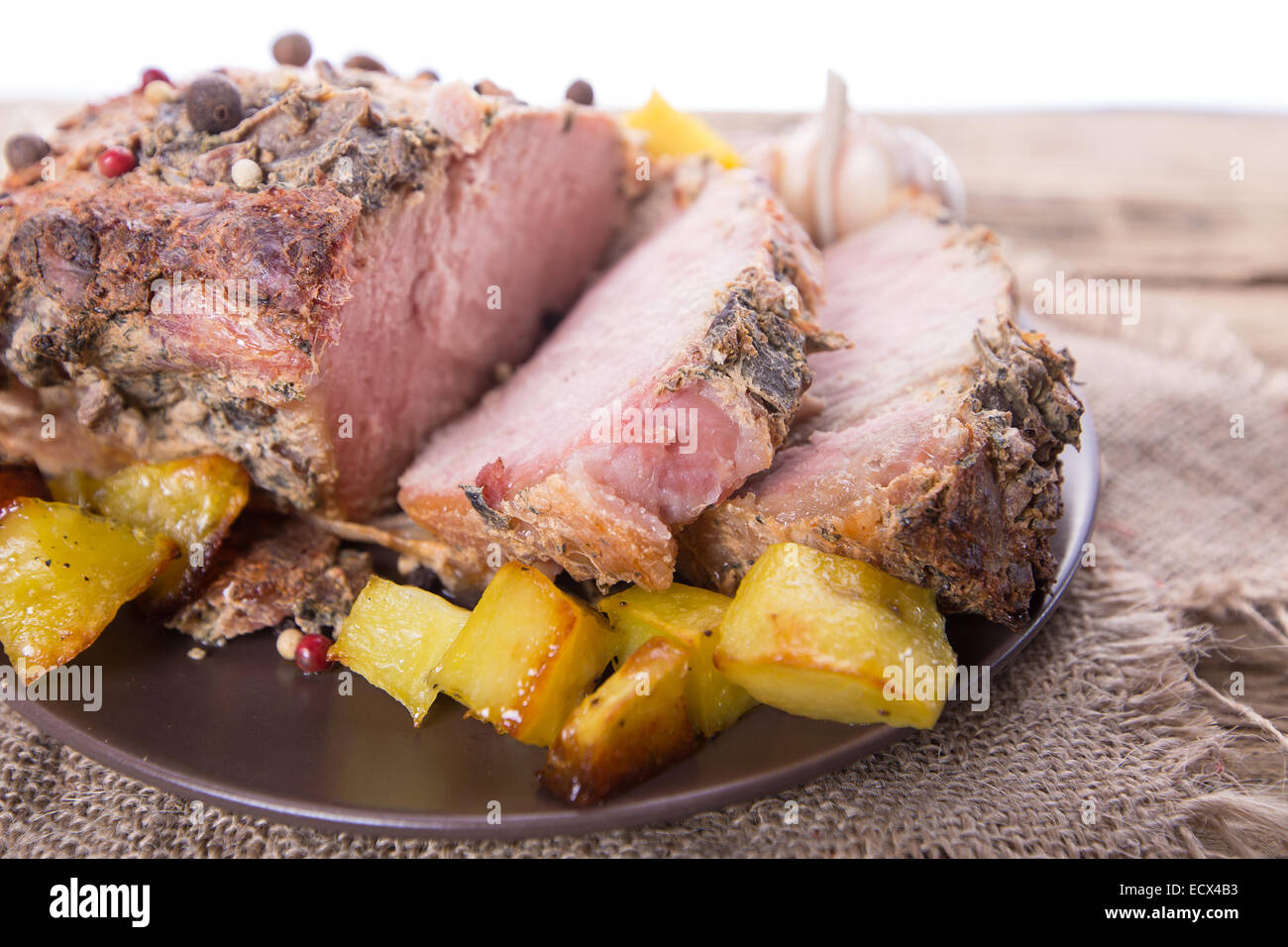 Meat Roted Roasted meat slices on a wooden background Stock Photo - Alamy