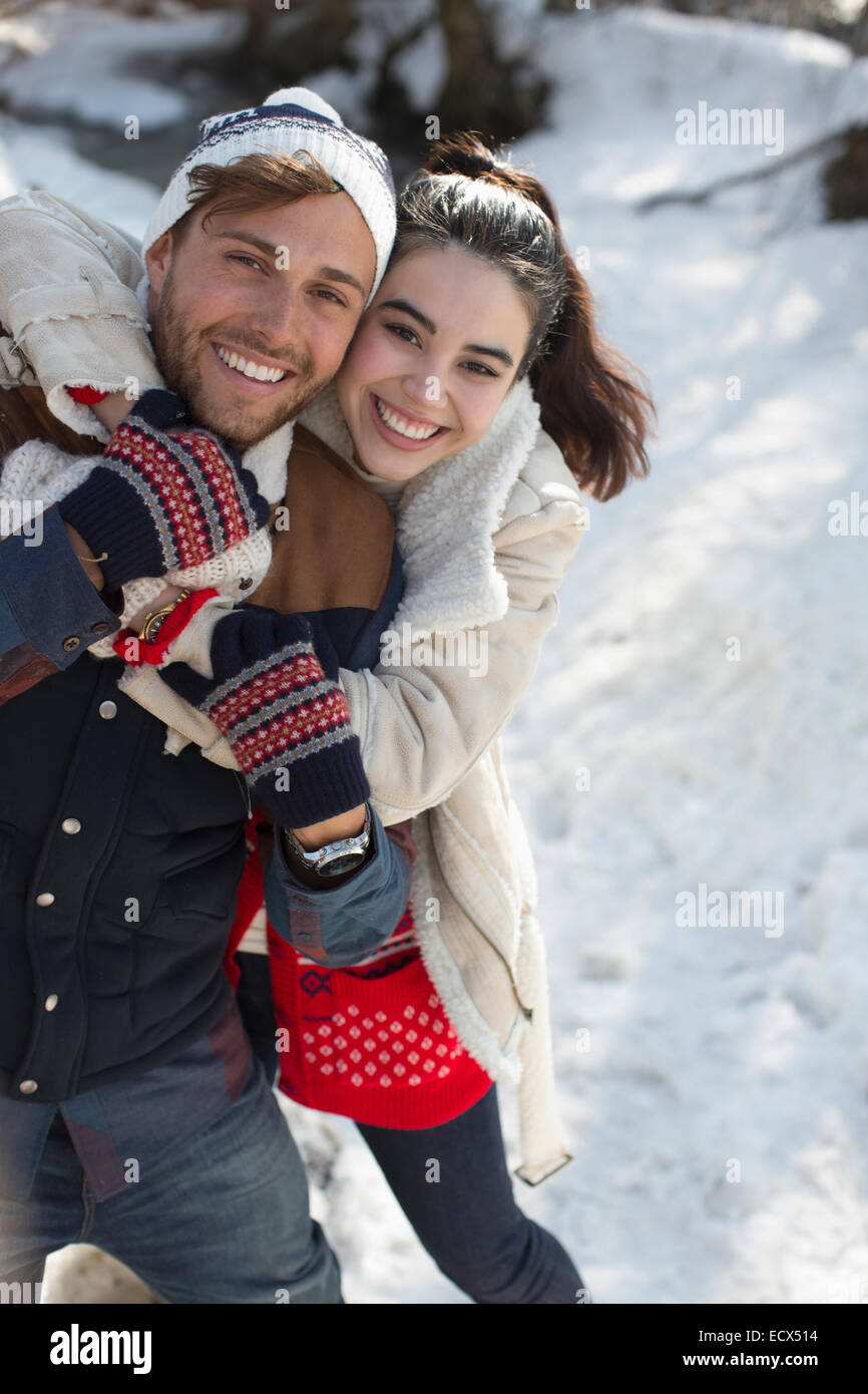 Portrait of smiling couple in snow Stock Photo