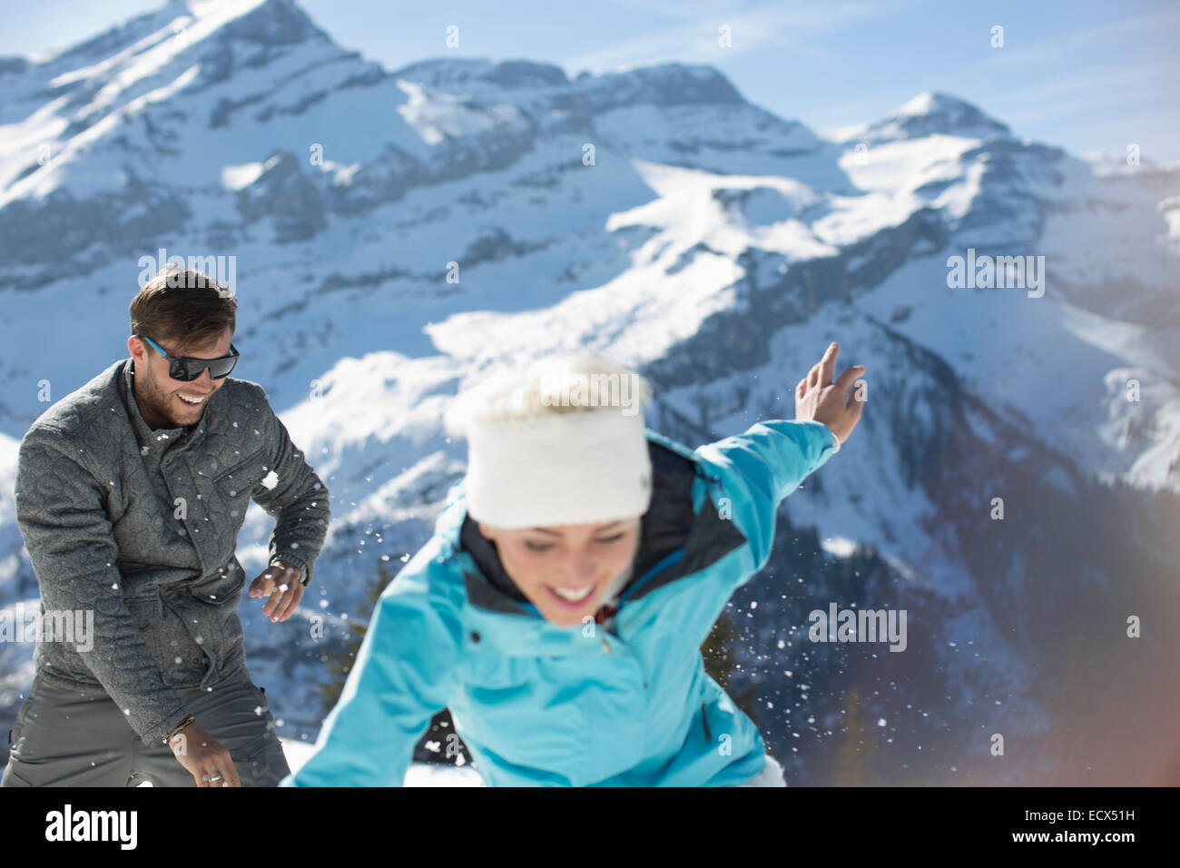 Couple playing in snow Stock Photo