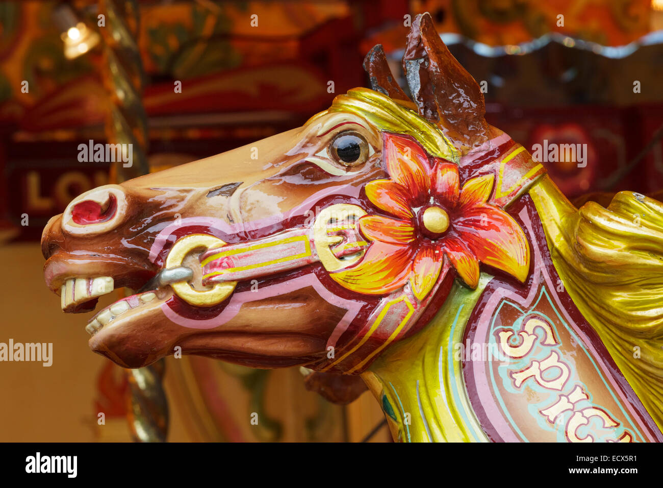 A shiny wooden head of a horse on a vintage carousel Stock Photo