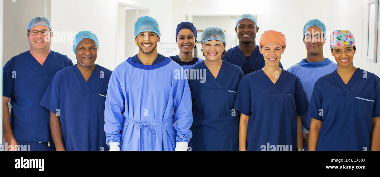 Group portrait of surgeons standing in hospital corridor Stock Photo