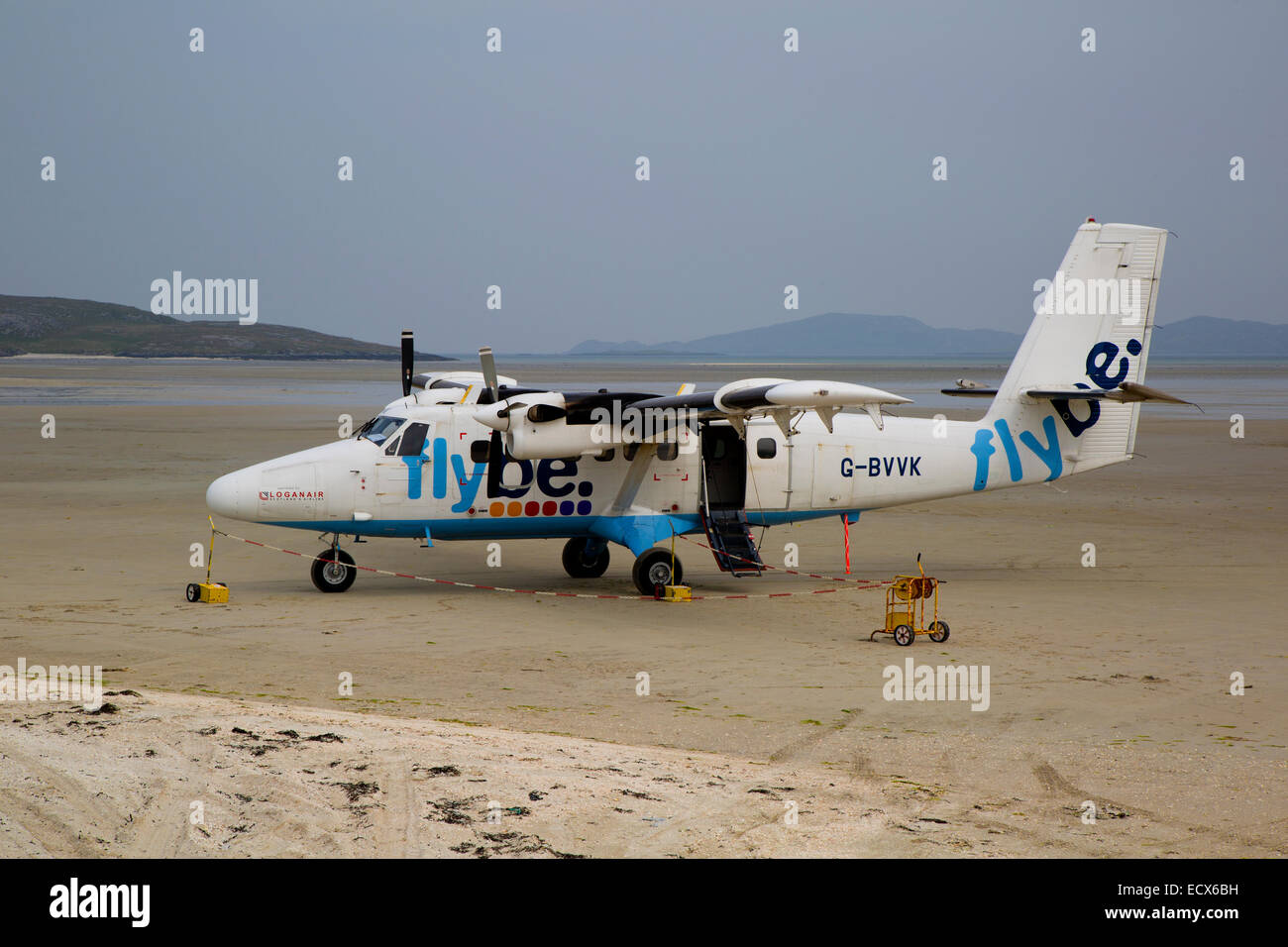 De Havilland (Canada) DHC-6 Twin Otter Series 310 G-BYVK parked on the beach at the Isle of Barra Airport Stock Photo