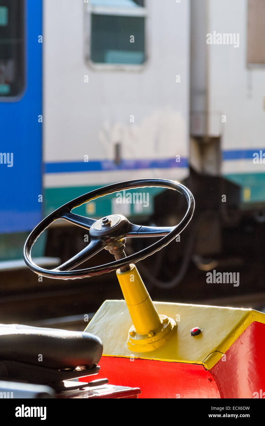 Steering wheel of a baggage carrier cart on a train station Stock Photo