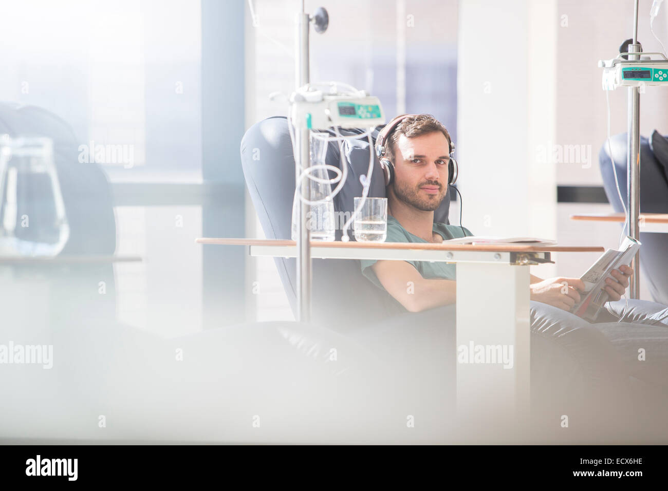 Portrait of man receiving intravenous infusion in hospital Stock Photo