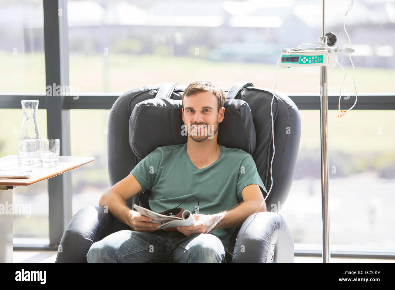 Portrait of smiling patient undergoing medical treatment in outpatient clinic Stock Photo