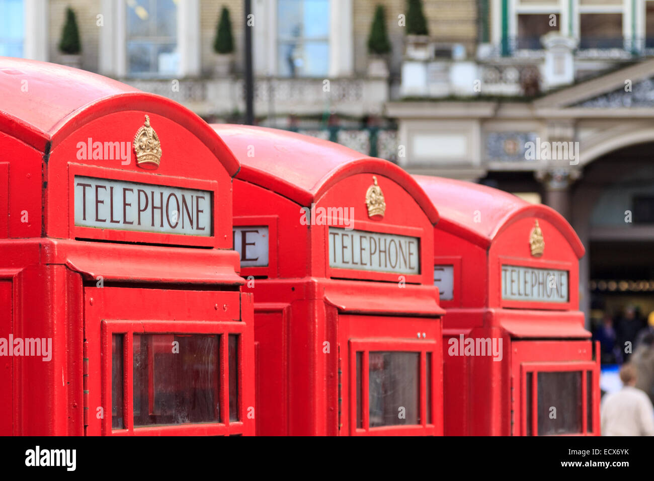 Three typical London red telephone booths next to each other Stock Photo