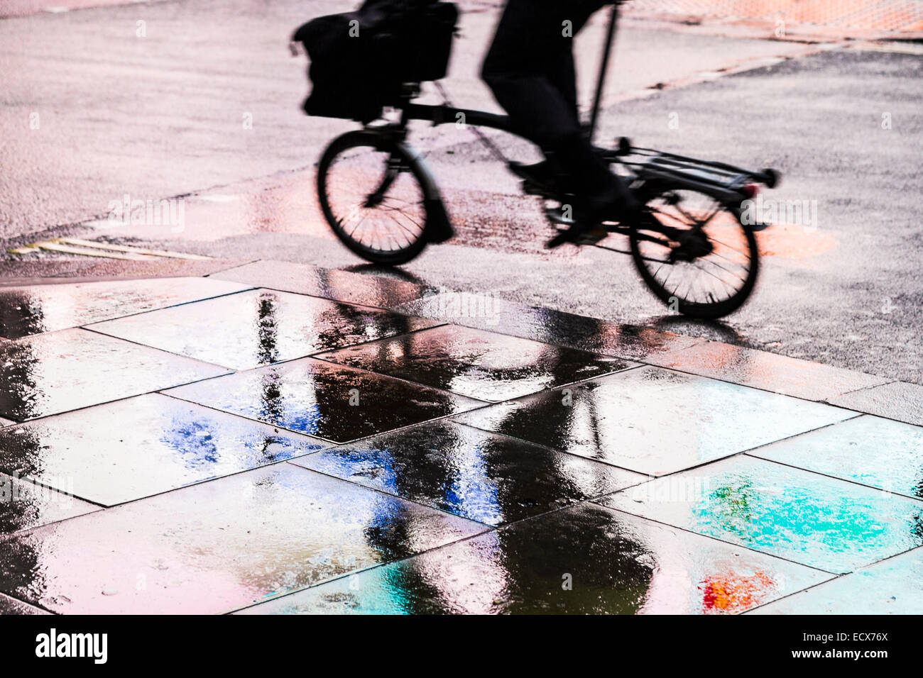 Coloured reflections on rain effected pavement - London Stock Photo