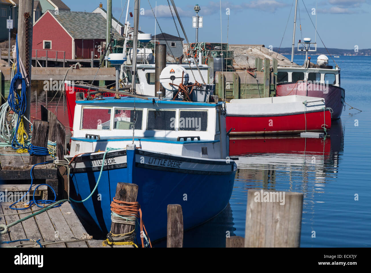 Fishing boats along the wharf in Peggy's Cove, Nova Scotia Stock Photo