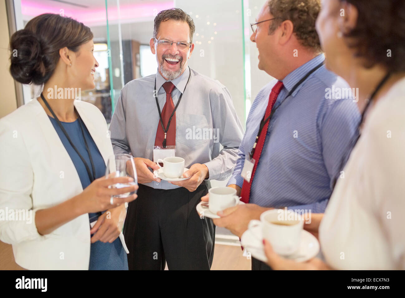 People in lobby of conference center during coffee break Stock Photo