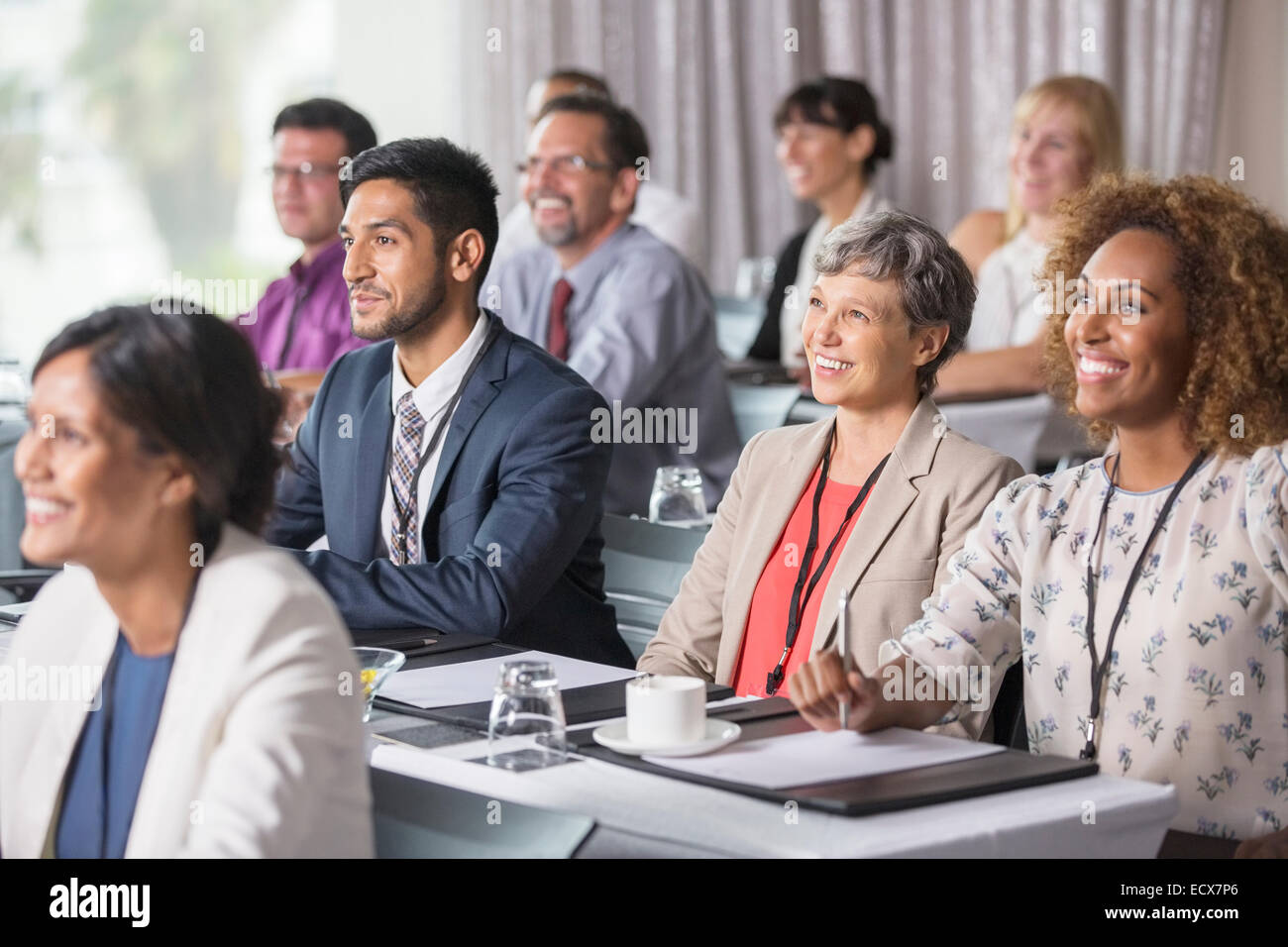 Group of people sitting and listening to speech during seminar Stock Photo