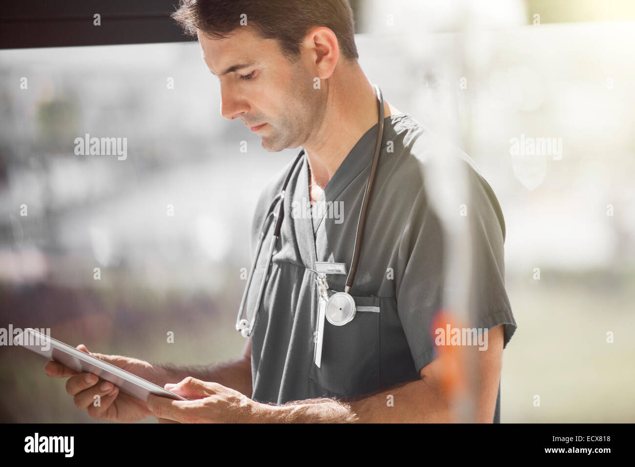 Dctor in hospital ward tablet pc Stock Photo