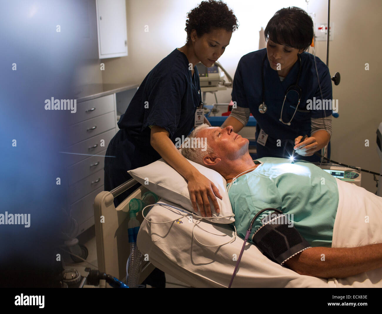 Doctor attending patient hires stock photography and images Alamy
