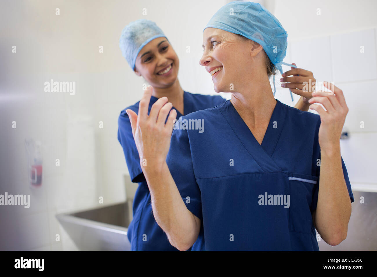 Two smiling surgeons getting ready for surgery Stock Photo