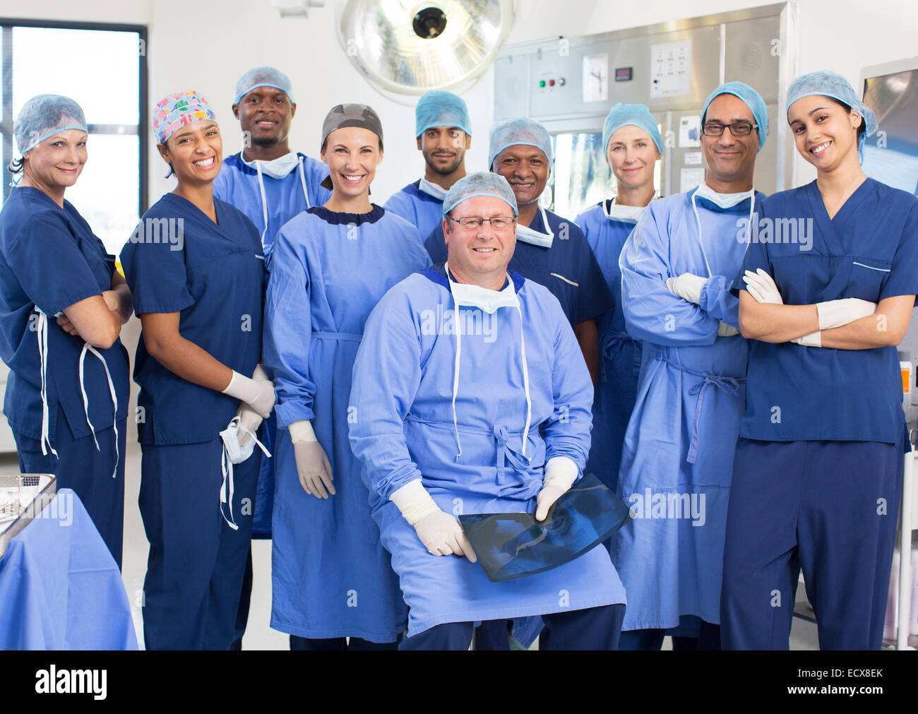 Team of doctors and nurses in operating theater Stock Photo