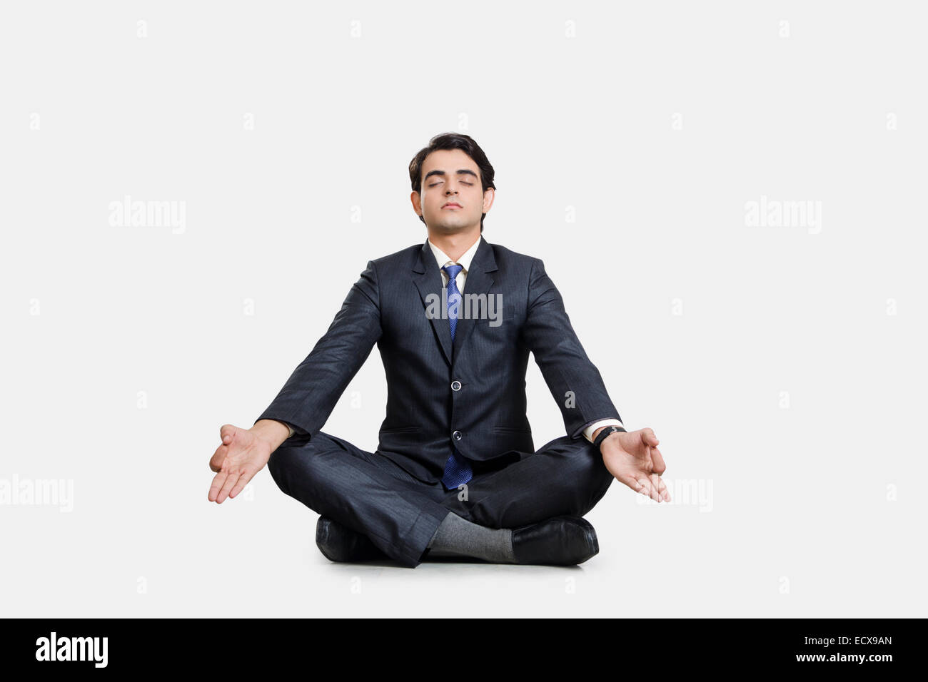 1 indian Business man yoga  Meditation Stock Photo