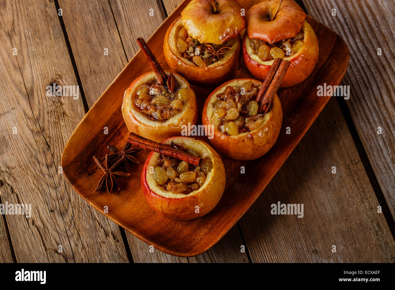 baked apples with raisins and cinnamon Stock Photo - Alamy