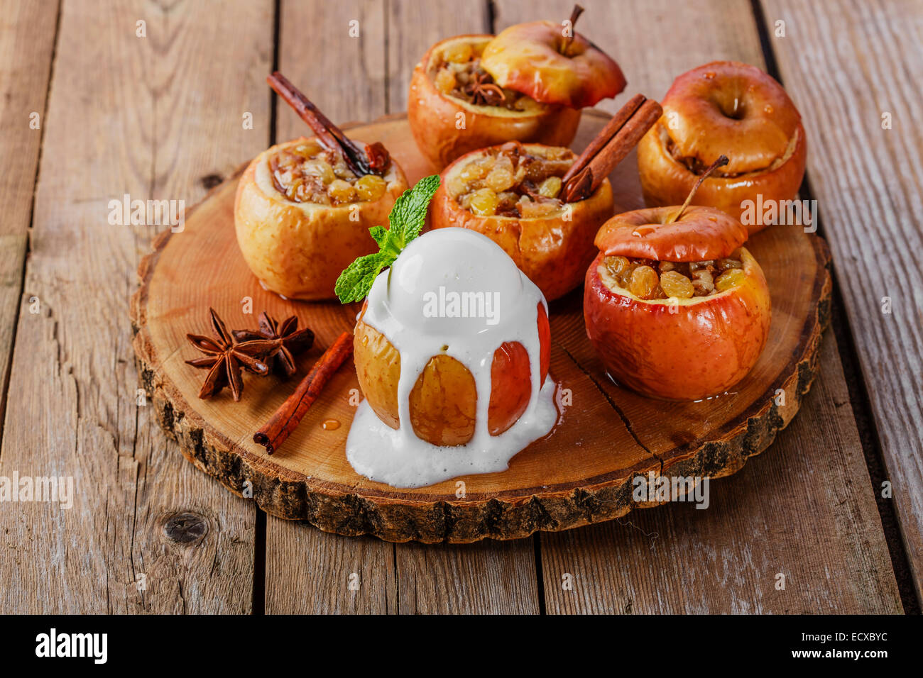 baked apples with raisins and cinnamon Stock Photo - Alamy